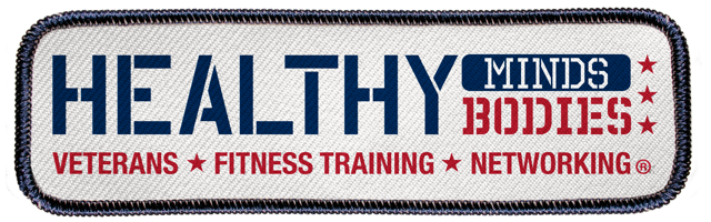 This logo is designed to look like a jacket patch, with dark blue stitching on the outside and white on the inside. The words on the patch read "Healthy Minds, Bodies. Veterans, Fitness Training, Networking." There are red stars separating the last three phrases.