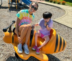 Camp Counselor with Emily at playground on bumblebee equipment 2025